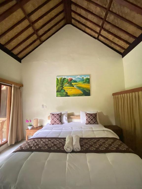 Postel nebo postele na pokoji v ubytování Pomelo Guest House