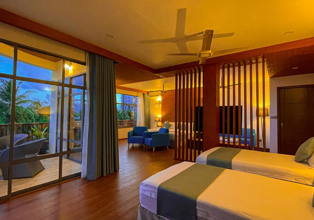 Postel nebo postele na pokoji v ubytování Araamu Hotels Maldives at Dhiffushi