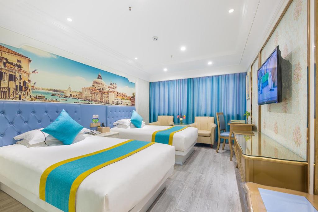 Postel nebo postele na pokoji v ubytování Yiwu Defeng Hotel