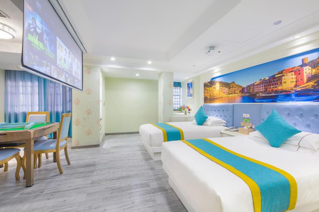 Postel nebo postele na pokoji v ubytování Yiwu Defeng Hotel