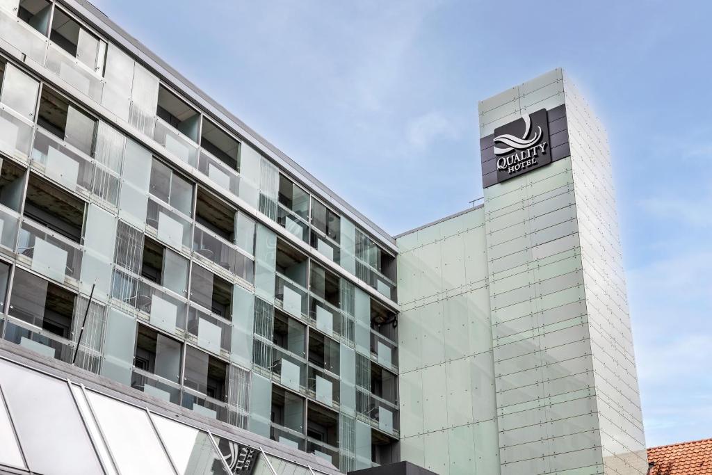 a building with a sign on the side of it at Quality Hotel Maritim in Haugesund