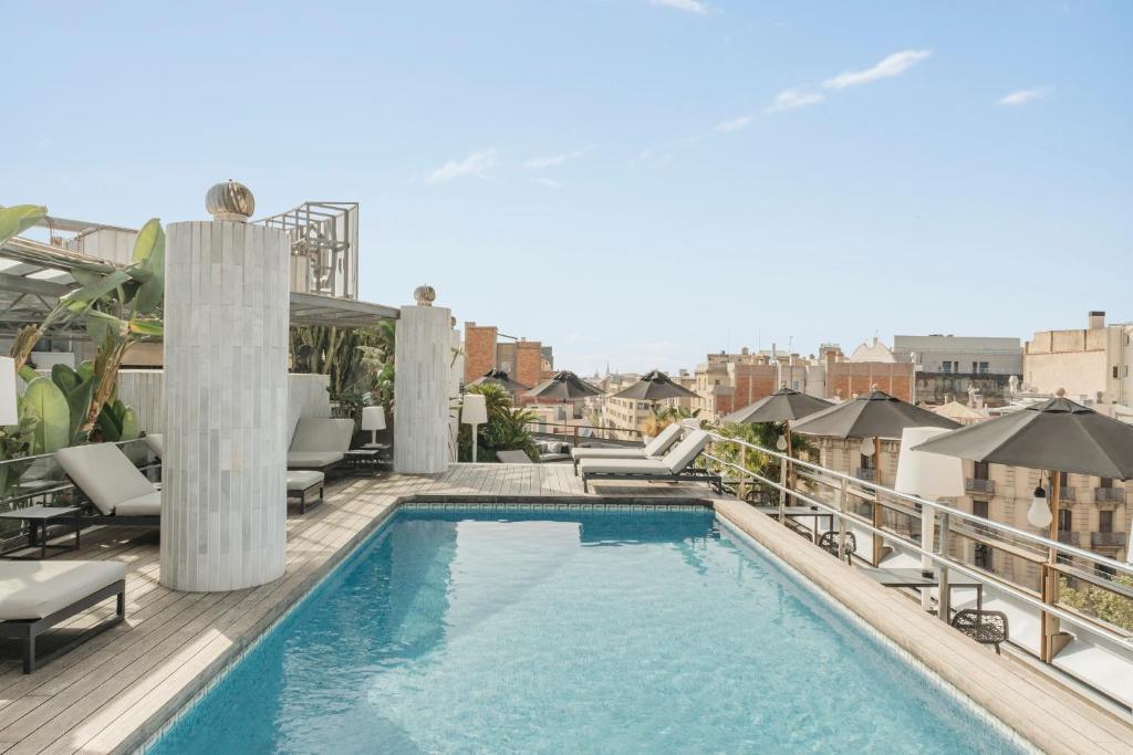 a swimming pool on the roof of a building at Claris Hotel & Spa GL, a Small Luxury Hotel of the World in Barcelona