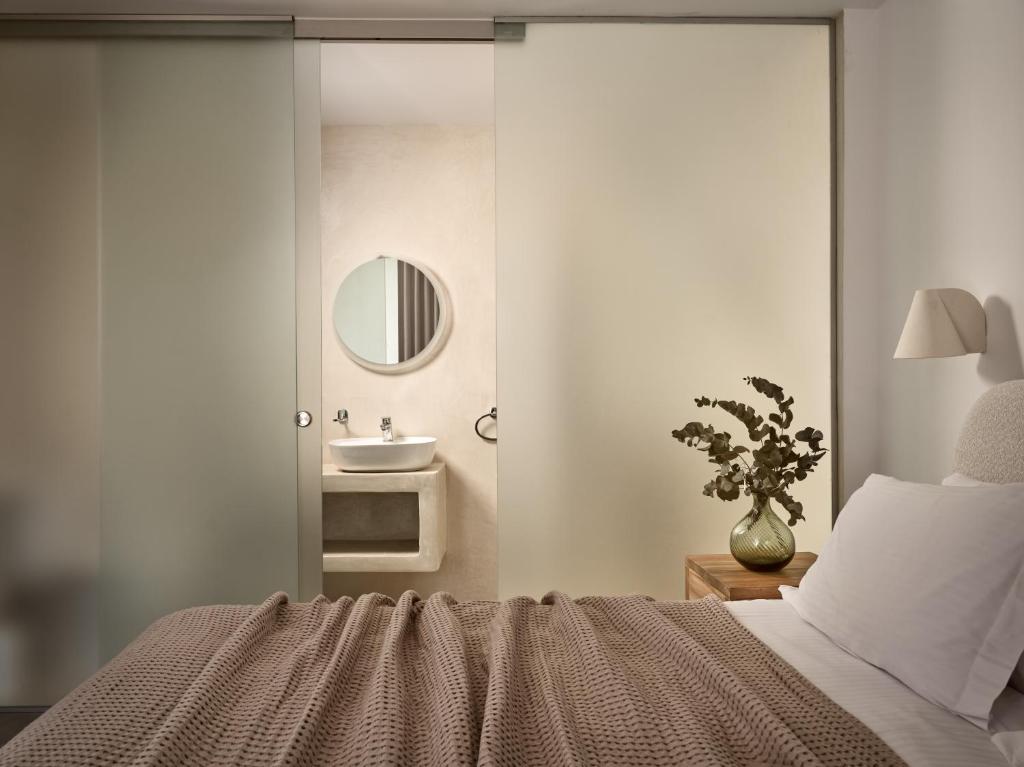 Postel nebo postele na pokoji v ubytování Azera Suites