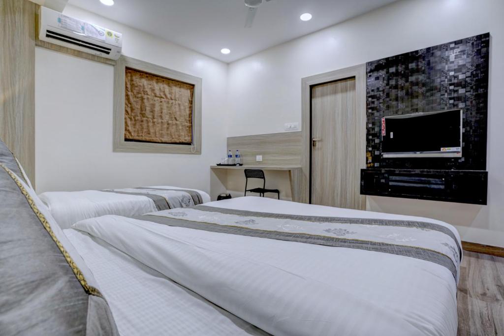 Letto o letti in una camera di Hotel Arts International