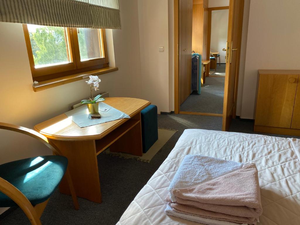 Postel nebo postele na pokoji v ubytování Samoobslužný hotel Vydra
