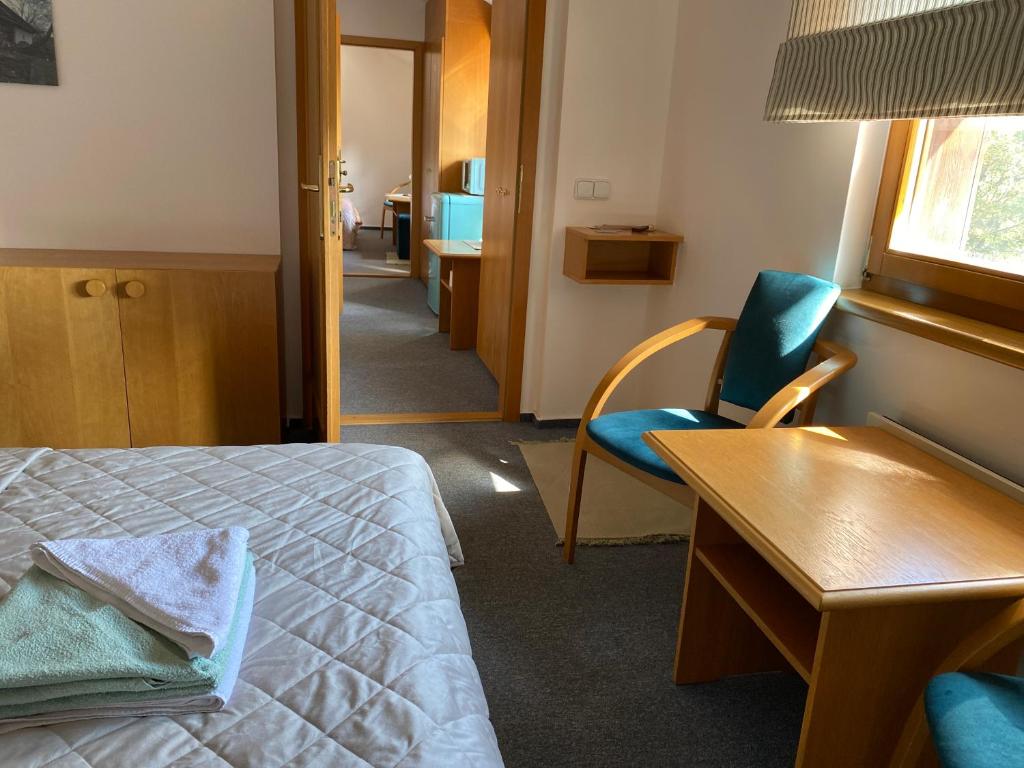 Postel nebo postele na pokoji v ubytování Samoobslužný hotel Vydra