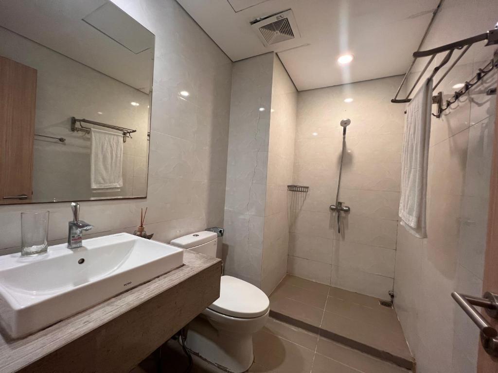 a bathroom with a sink and a toilet and a shower at 3415B Mipec Riverside nice view in Hanoi
