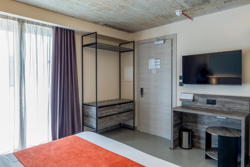 TV a/nebo společenská místnost v ubytování Alavits Hotel by ST Hotels