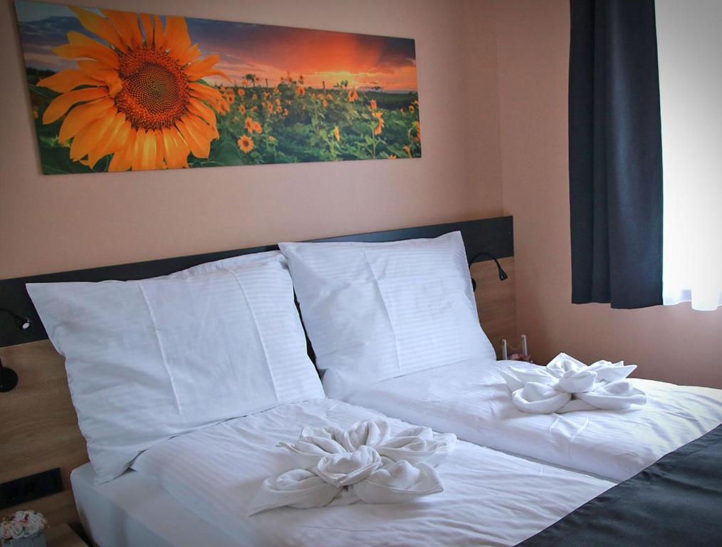 Postel nebo postele na pokoji v ubytování Sunset Bogács
