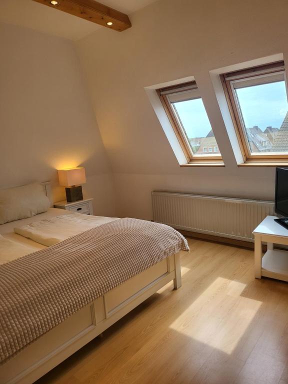 Postel nebo postele na pokoji v ubytování Villa am Meer
