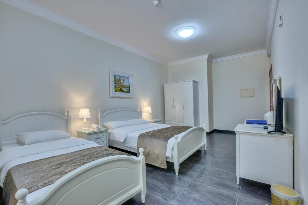 Postel nebo postele na pokoji v ubytování Royal Hotel