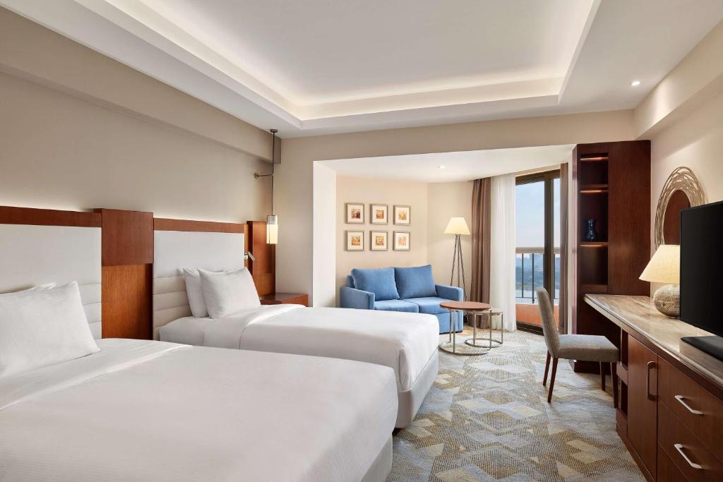 Postel nebo postele na pokoji v ubytování Ramses Hilton Hotel & Casino