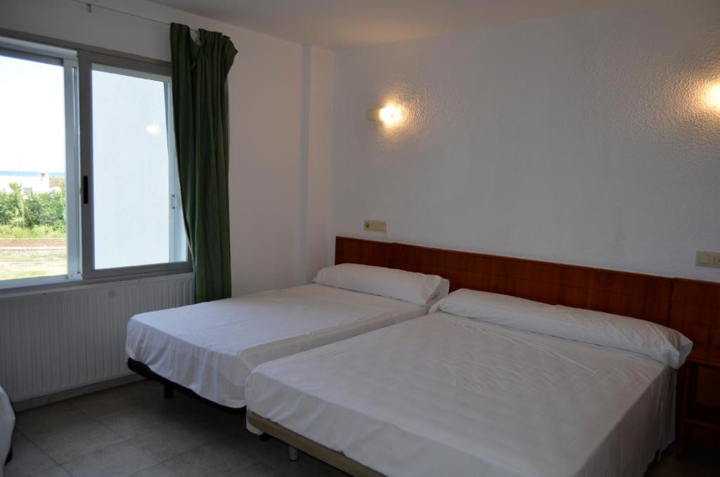 Postel nebo postele na pokoji v ubytování Hostal Blayet