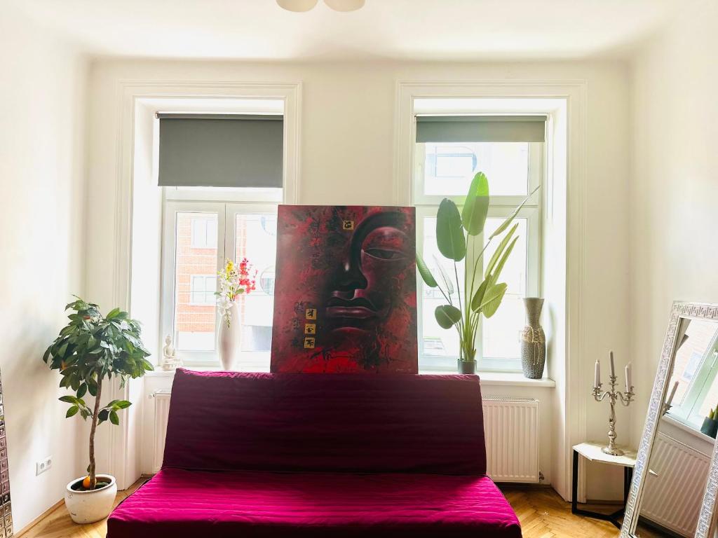 a bedroom with a bed with a purple bedspread at City Apartment in Vienna