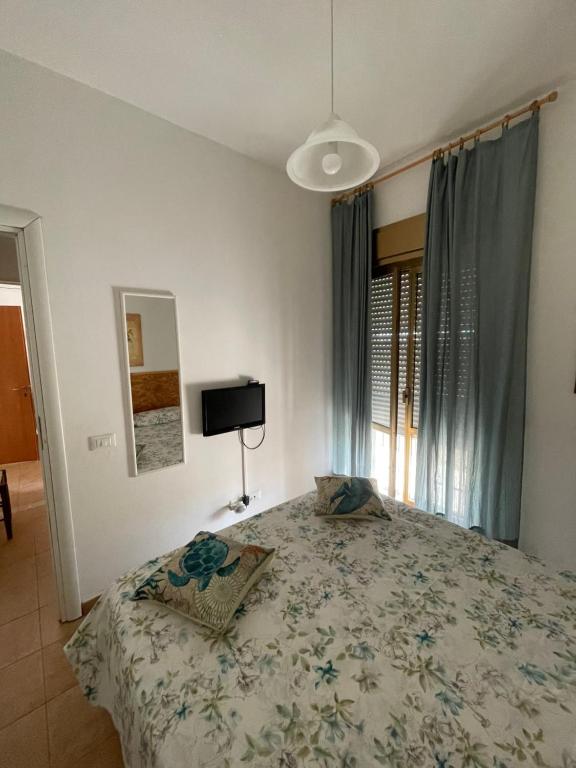 Postel nebo postele na pokoji v ubytování Paradiso fronte Mare