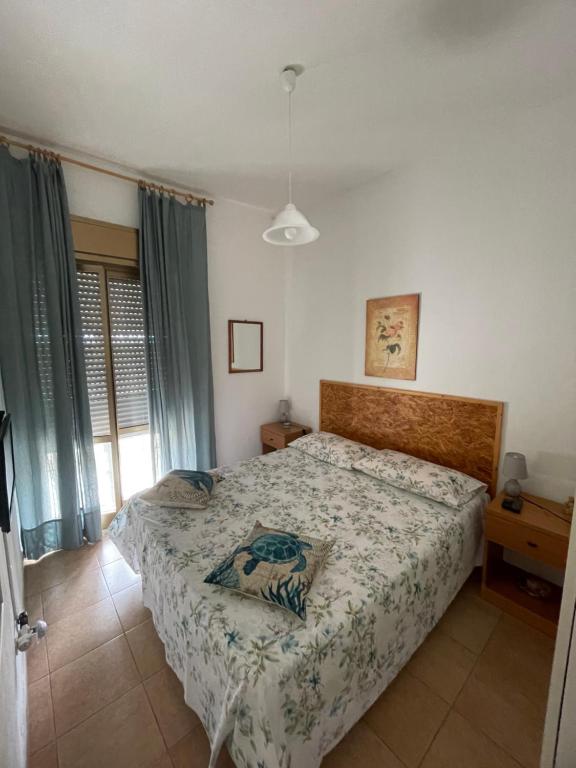 Postel nebo postele na pokoji v ubytování Paradiso fronte Mare