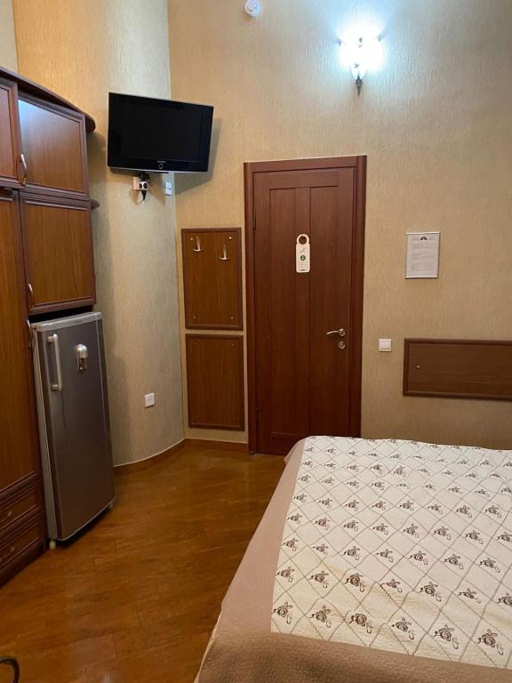 Postel nebo postele na pokoji v ubytování Hotel Pavo