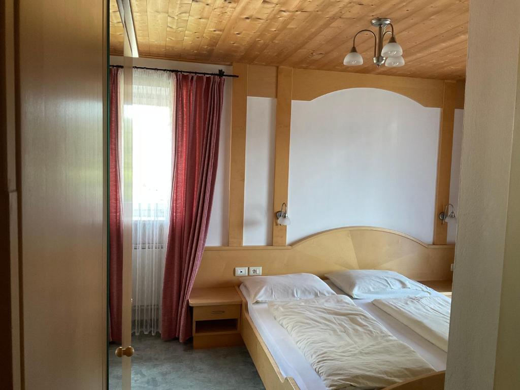 Postel nebo postele na pokoji v ubytování Garni Rika