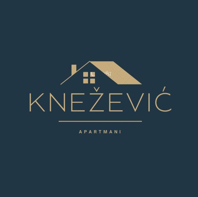 a logo for a real estate agency with a house at Knežević apartman in Podgorica