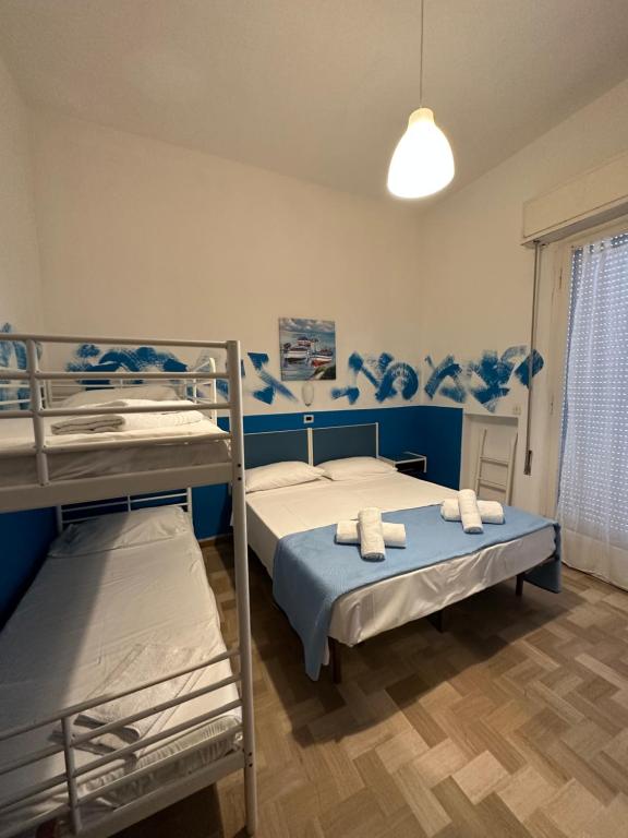 Postel nebo postele na pokoji v ubytování New Hotel Villa Enea