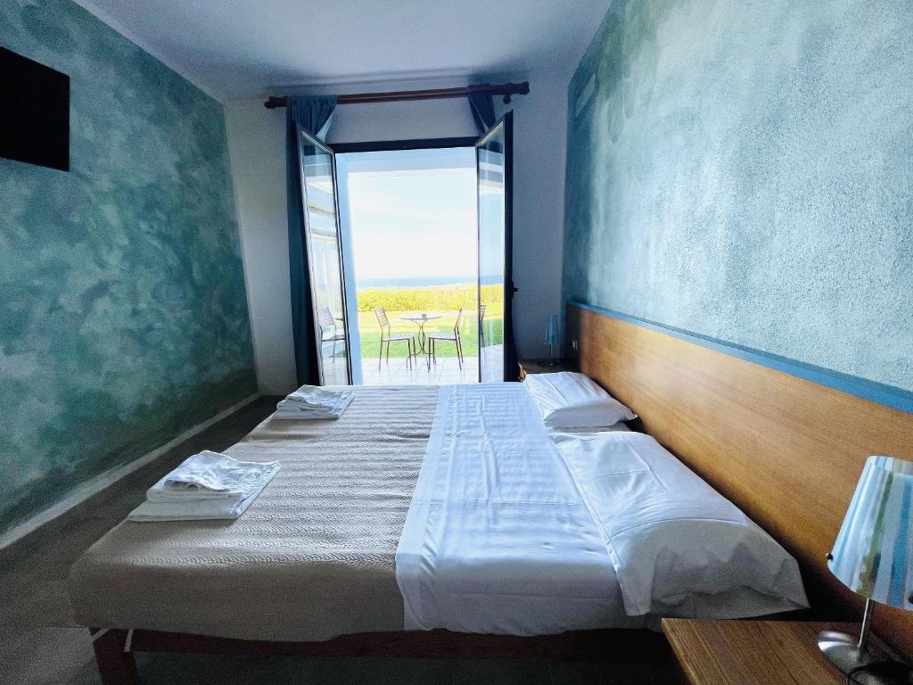 Postel nebo postele na pokoji v ubytování Abbaidda Hotel