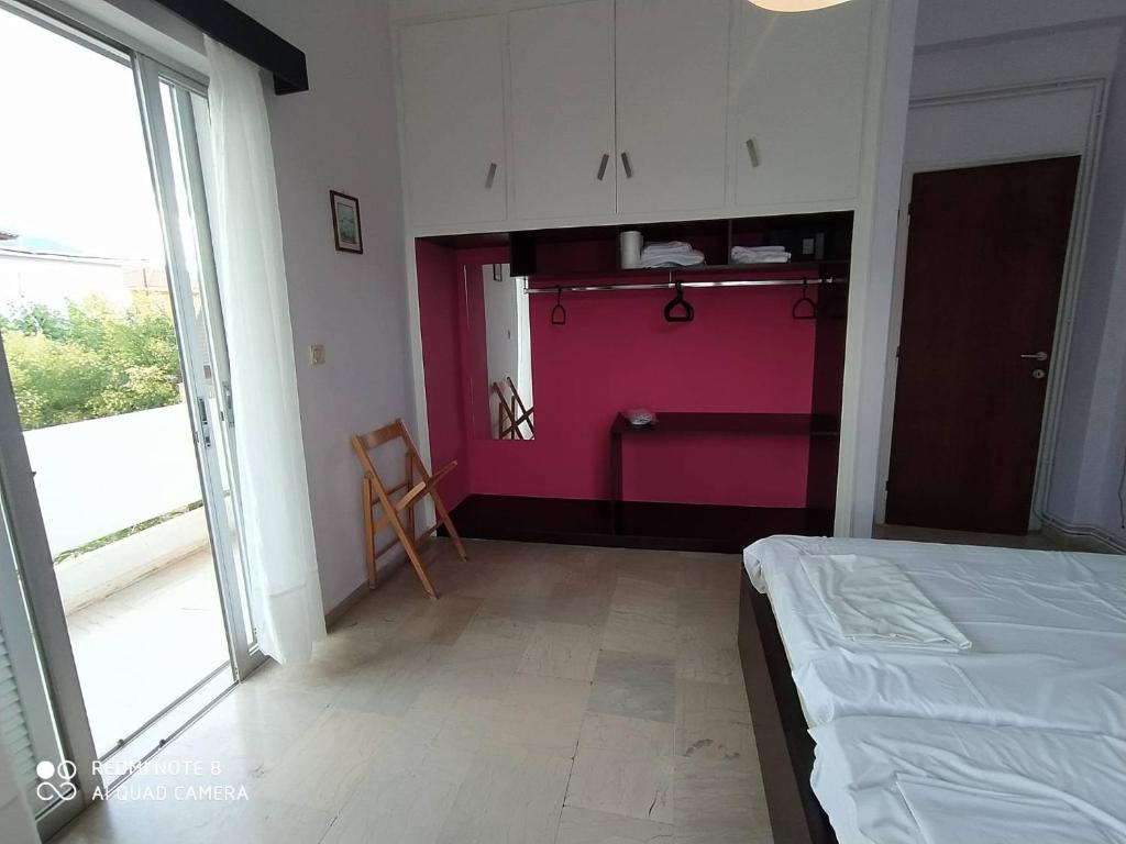 Postel nebo postele na pokoji v ubytování Dimitropoulos Apartments