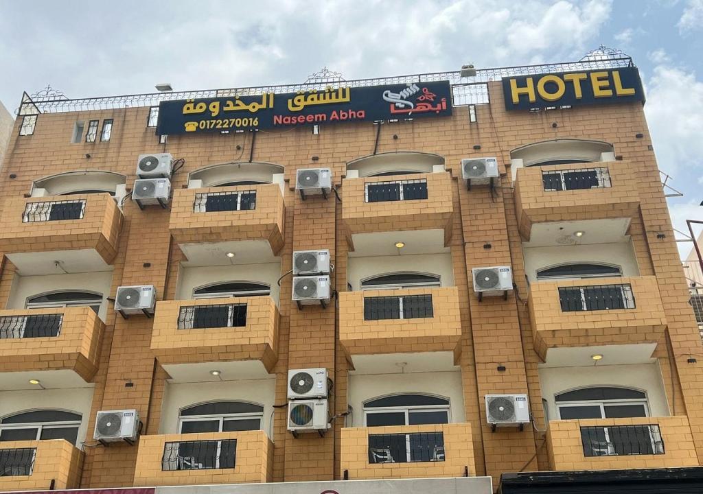 a building with speakers on the side of it at فندق نسيم أبها in Abha