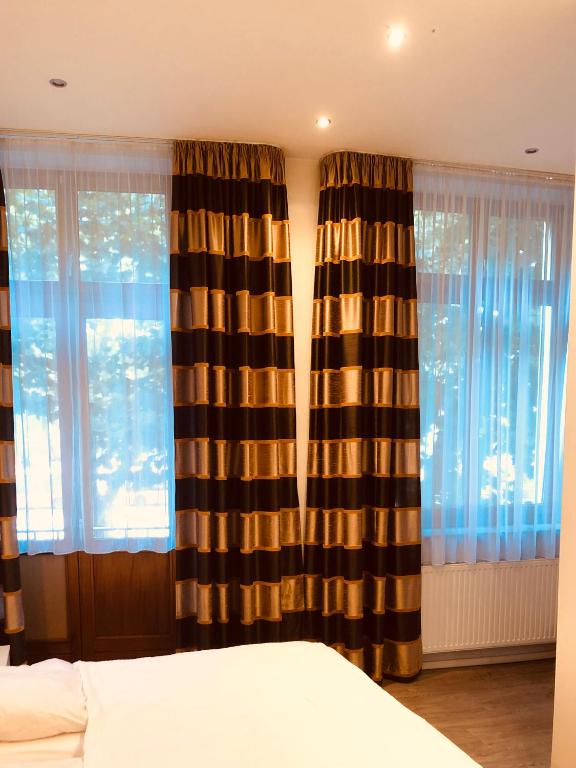 Postel nebo postele na pokoji v ubytování Hotel am Bahnhof
