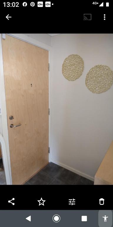 a picture of a room with a door and a wall at Nardo-Trondheim in Trondheim