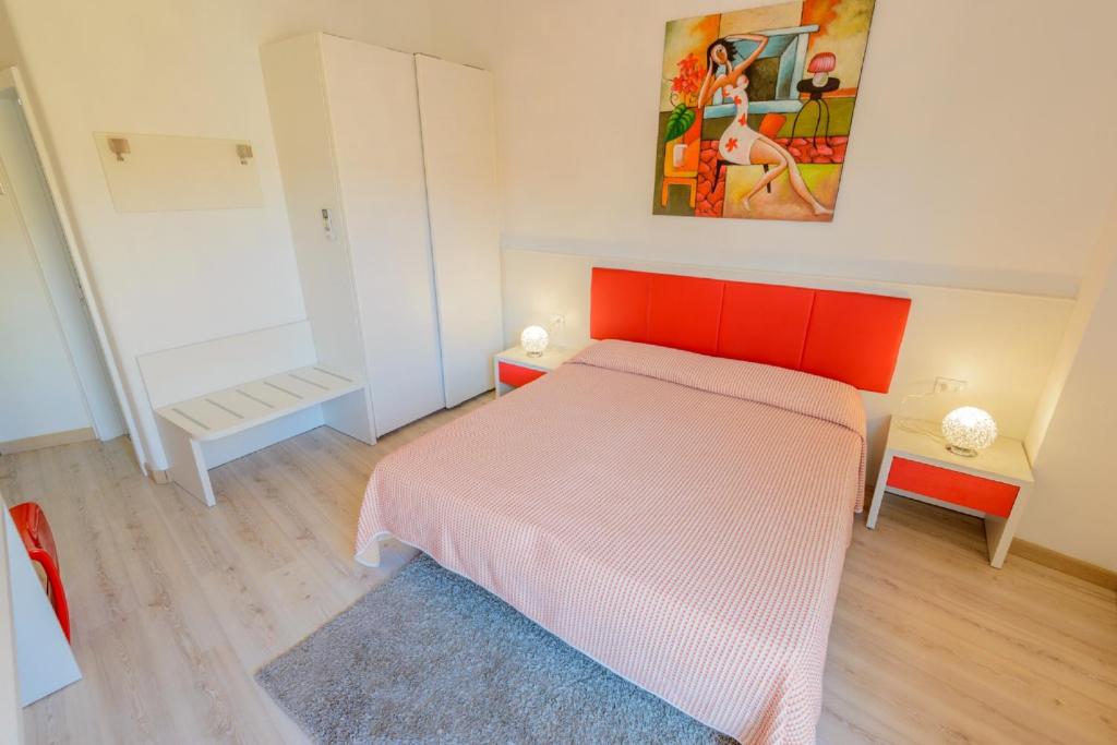 Postel nebo postele na pokoji v ubytování Hotel Alpino