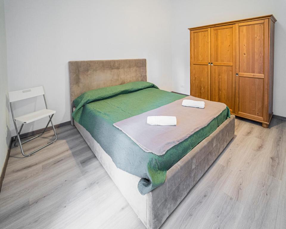 Łóżko lub łóżka w pokoju w obiekcie Appartamento Genova,400m dal San Martino