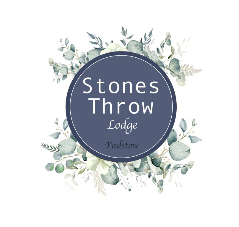 a blue circle frame with watercolor flowers and plants at Stones Throw Lodge in Padstow