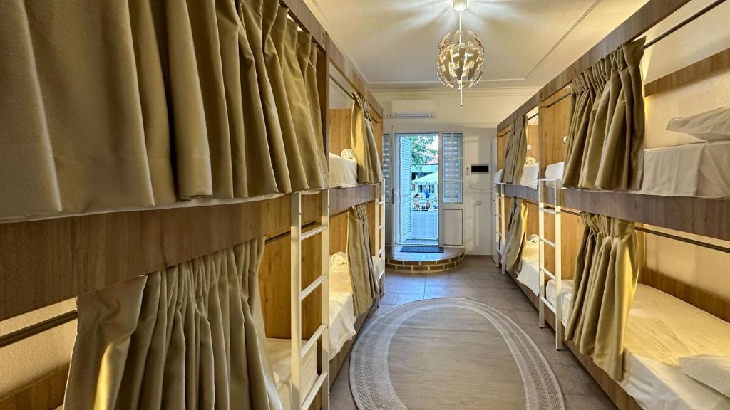 a hallway with shelves of beds in a room at Hostel da Praia in Portimão