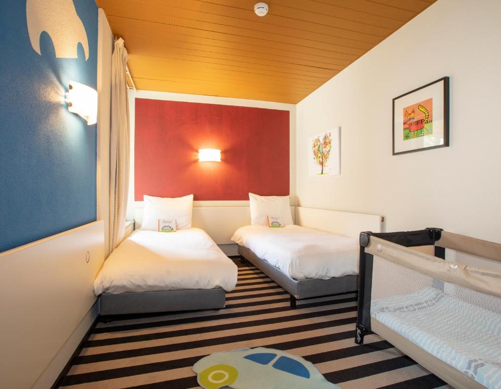 Postel nebo postele na pokoji v ubytování Fletcher Hotel-Restaurant Wolfheze