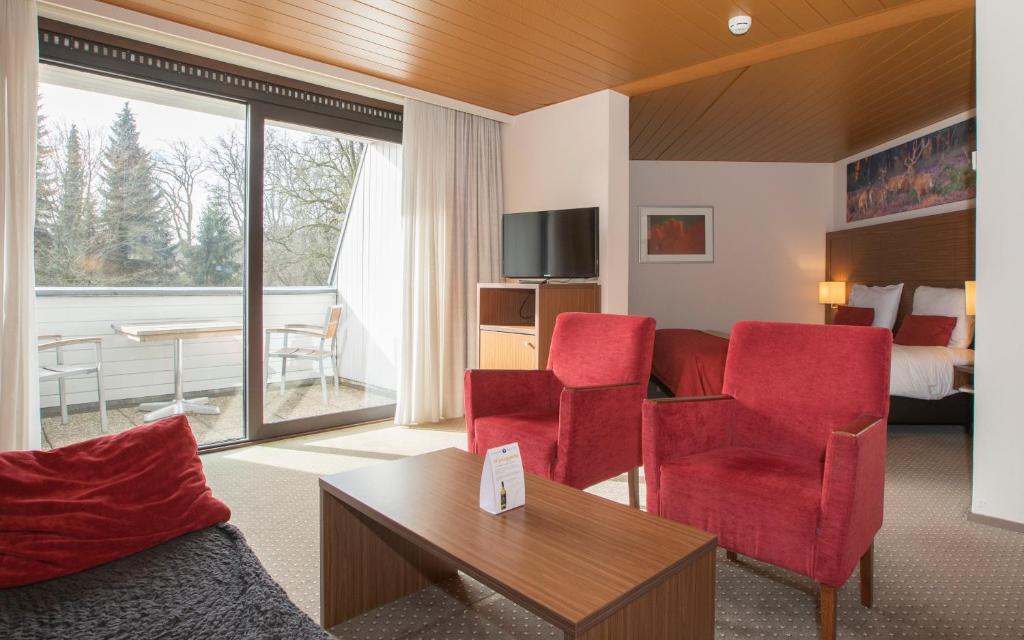 TV a/nebo společenská místnost v ubytování Fletcher Hotel-Restaurant Wolfheze