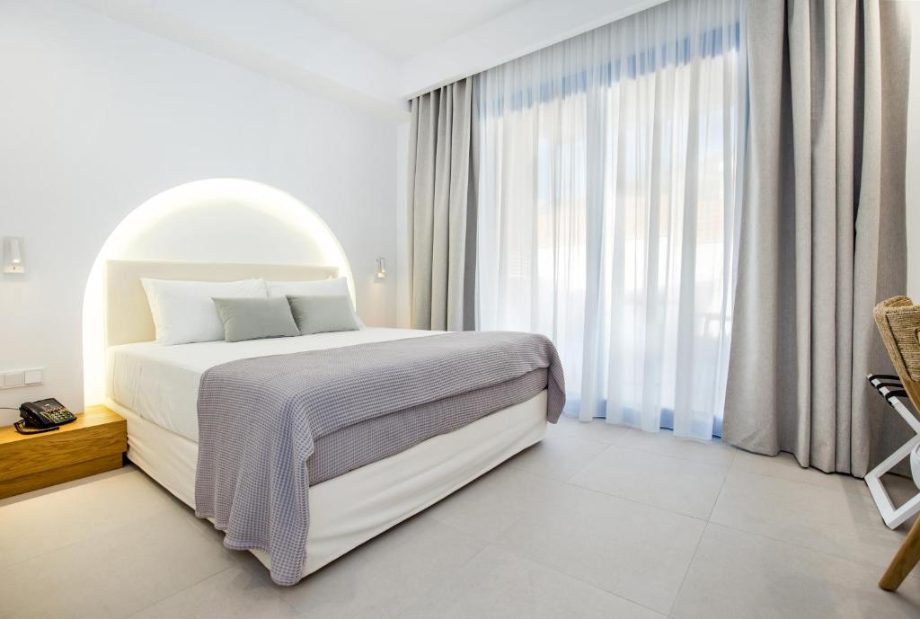 Postel nebo postele na pokoji v ubytování euphoria boutique hotel