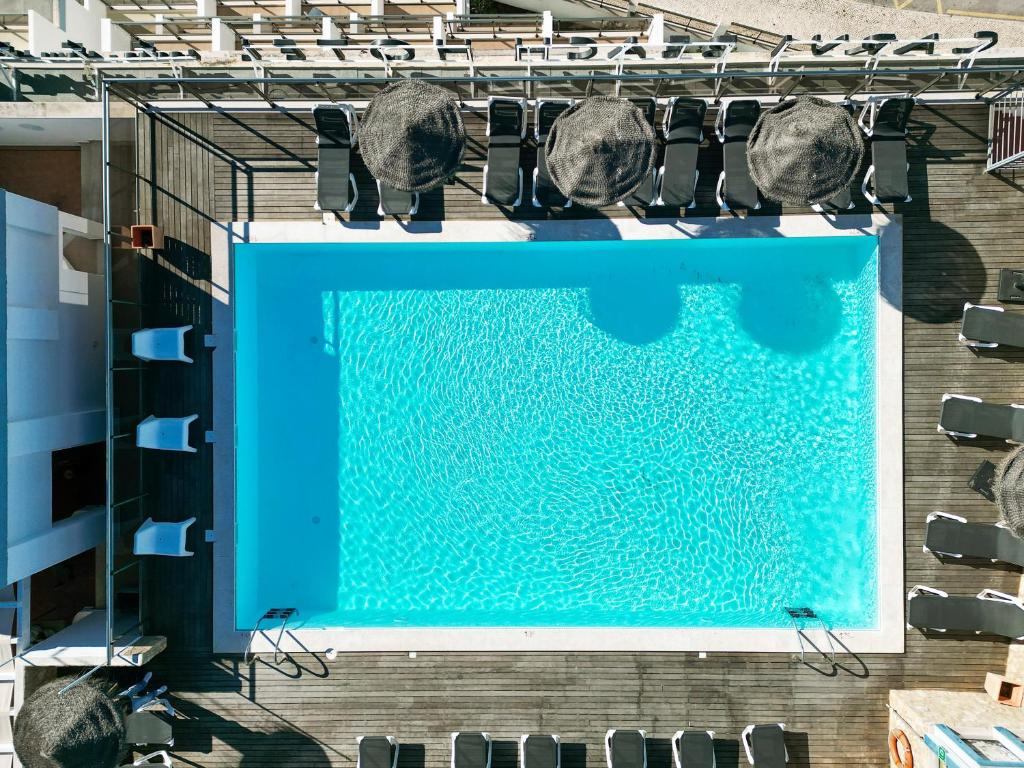 an overhead view of a swimming pool on a building at Carvi Beach Hotel in Lagos
