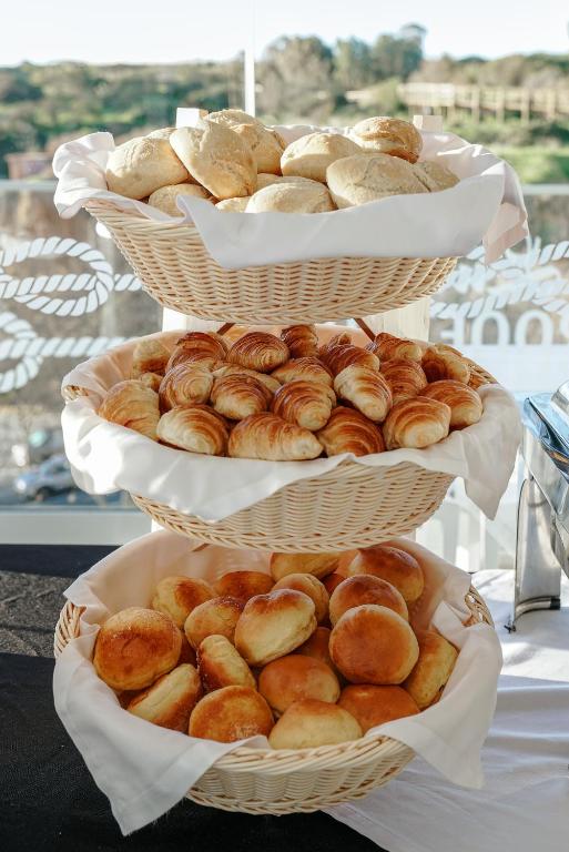 three baskets filled with different types of bread at Carvi Beach Hotel in Lagos