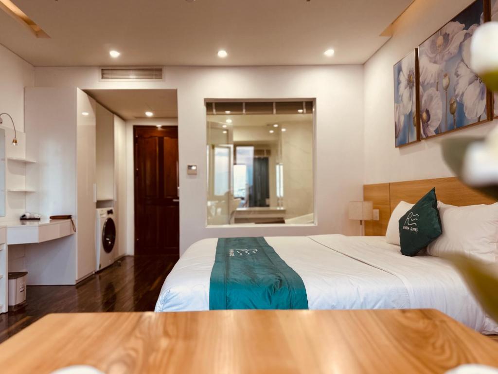 Postel nebo postele na pokoji v ubytování Rivera Suites