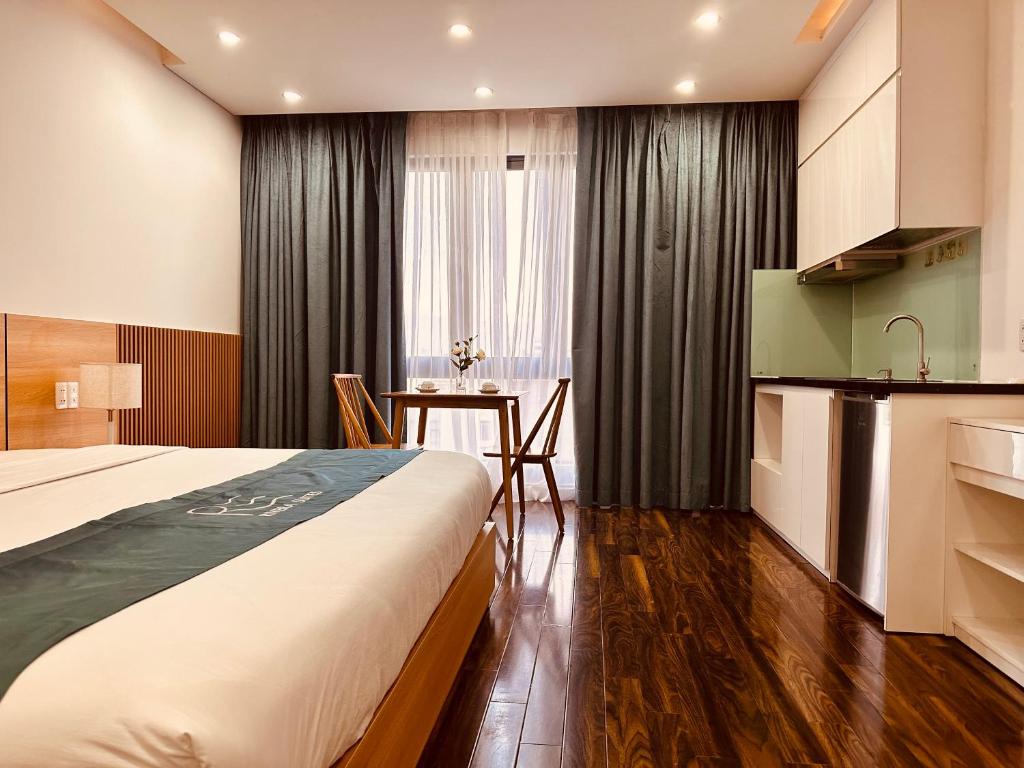 Postel nebo postele na pokoji v ubytování Rivera Suites