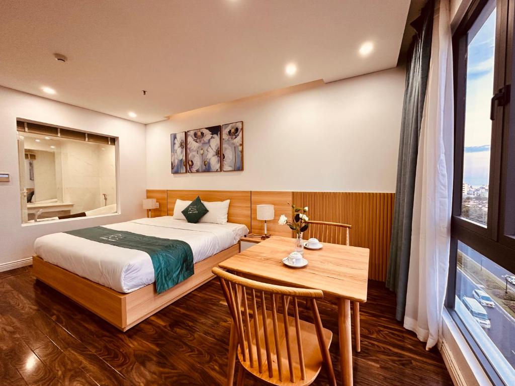 Postel nebo postele na pokoji v ubytování Rivera Suites