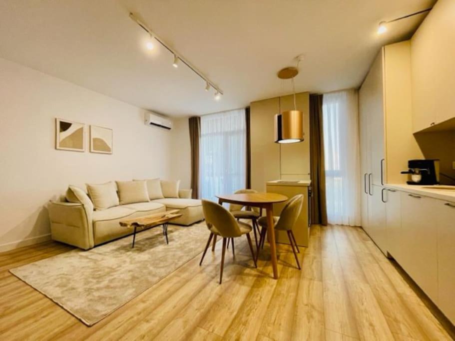 a living room with a couch and a table at Joy City Stay Vivalia 7B-26 in Timişoara
