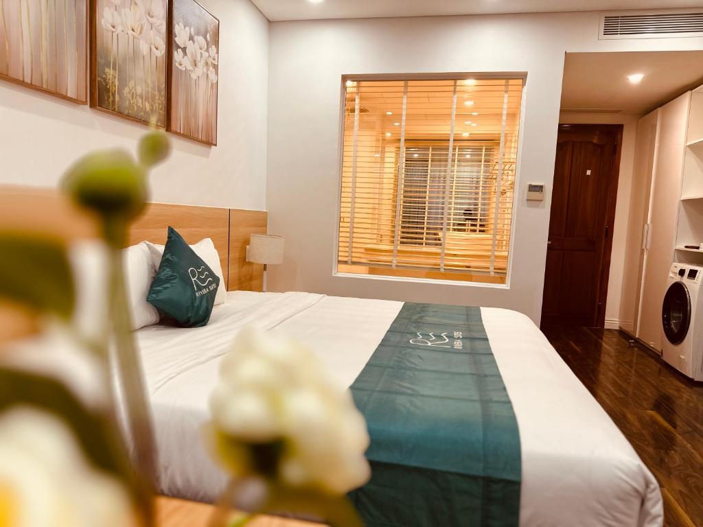 Postel nebo postele na pokoji v ubytování Rivera Suites