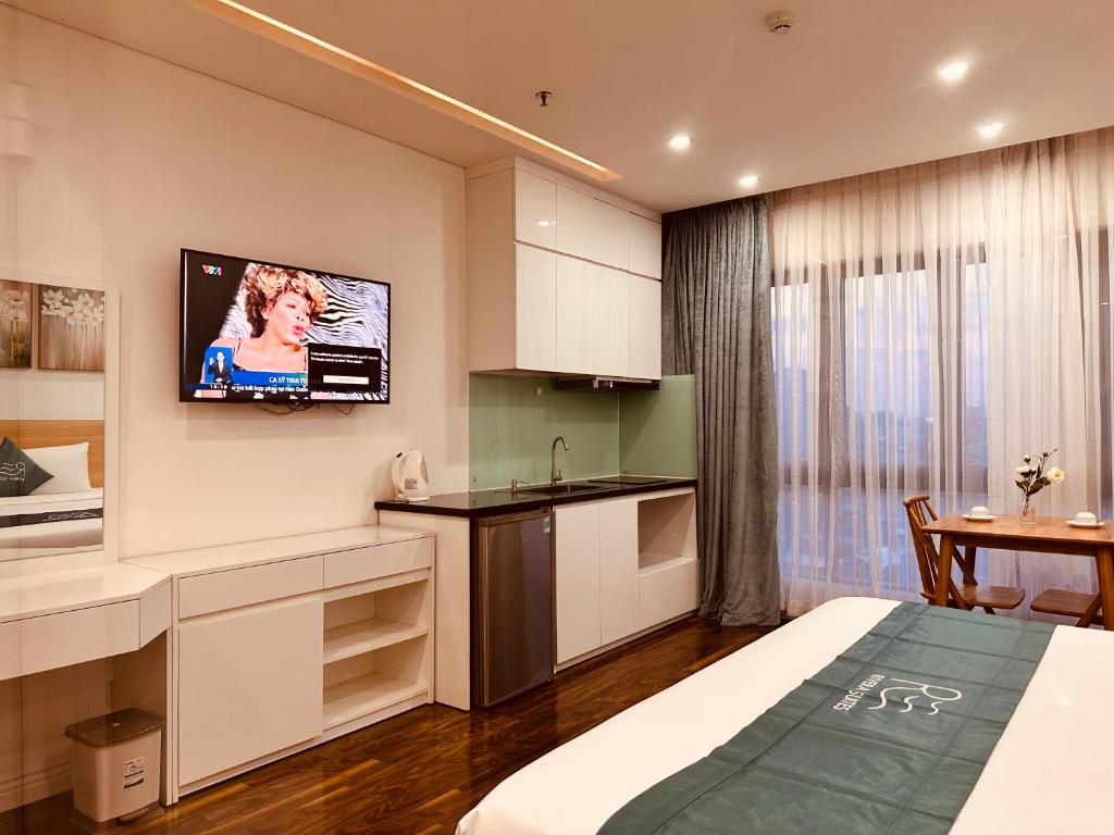 TV a/nebo společenská místnost v ubytování Rivera Suites