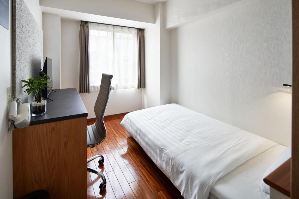 Postel nebo postele na pokoji v ubytování TOKIO's HOTEL