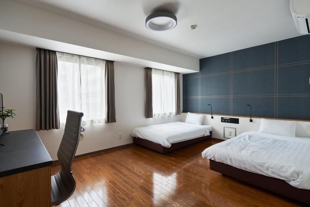 Postel nebo postele na pokoji v ubytování TOKIO's HOTEL