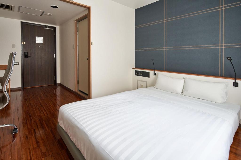 Postel nebo postele na pokoji v ubytování TOKIO's HOTEL