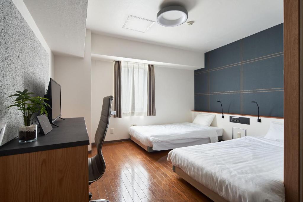 Postel nebo postele na pokoji v ubytování TOKIO's HOTEL