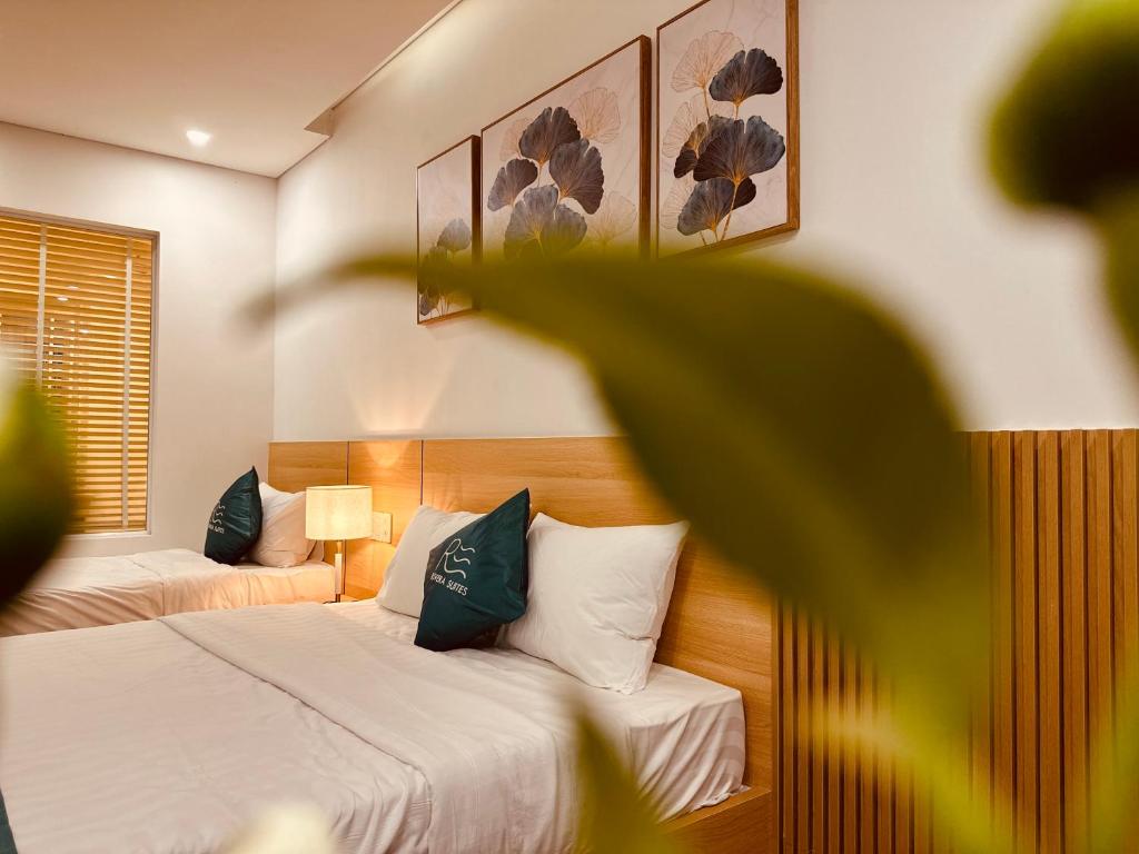 Postel nebo postele na pokoji v ubytování Rivera Suites