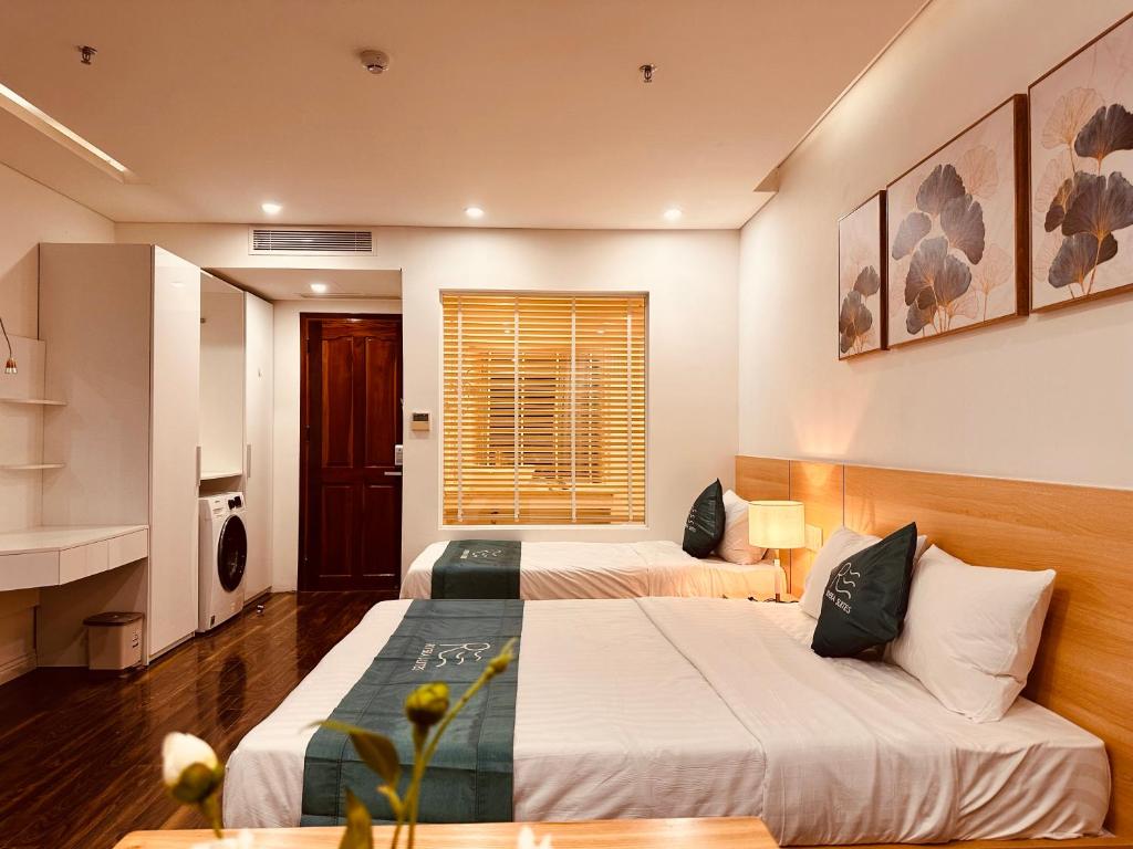 Postel nebo postele na pokoji v ubytování Rivera Suites